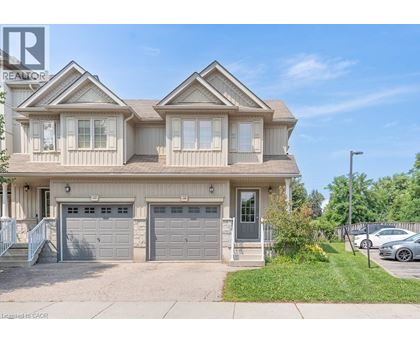 A two-story house with a garage is for sale.