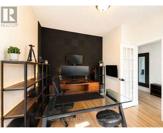 A modern living room with a glass table and a television.