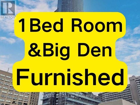 A sign advertising a 1 bedroom and a big den furnished.