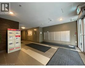 A realtor's office with a white board on the wall.