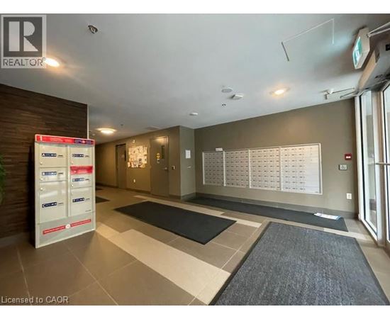 A realtor's office with a white board on the wall.
