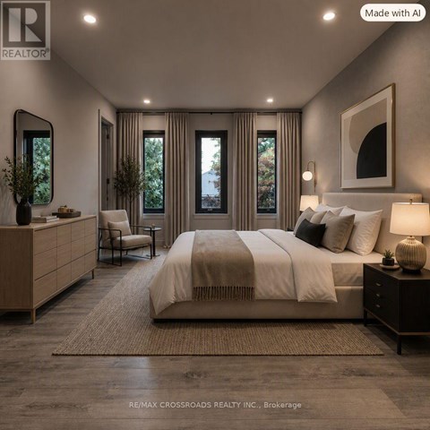 A well-lit bedroom with a large bed, a chair, and a side table.