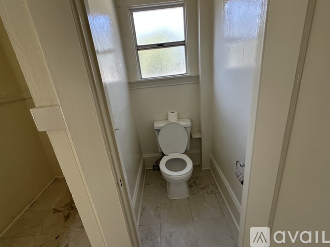 A ladder is leaning against a wall in a bathroom.