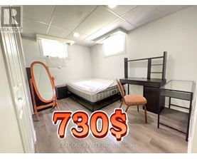 A bedroom with a bed, desk, and chair is on sale for 730 dollars.