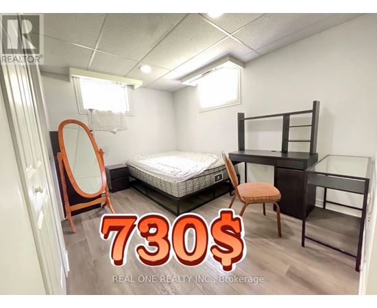 A bedroom with a bed, desk, and chair is on sale for 730 dollars.