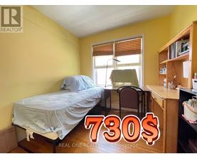A bedroom with a bed, chair, and desk is on sale for 730$.