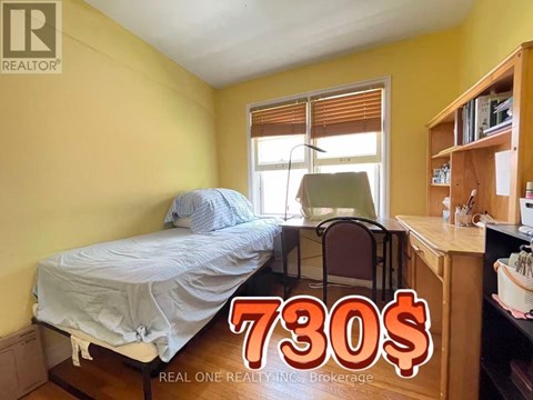 A bedroom with a bed, chair, and desk is on sale for 730$.