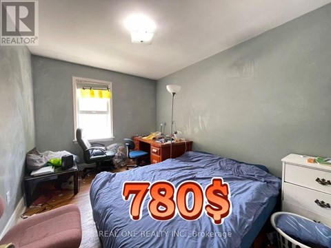 A bedroom with a bed covered in a 780$ bedsheet.