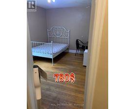 A bedroom with a bed, chair, and a price tag of 780$.
