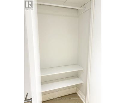 Empty white shelves in a room.