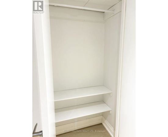 Empty white shelves in a room.