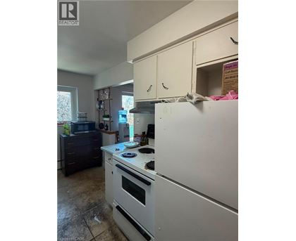 A kitchen with a white refrigerator and a white oven.