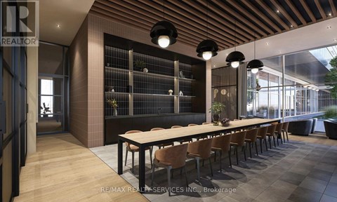 A modern dining room with a long table and chairs.