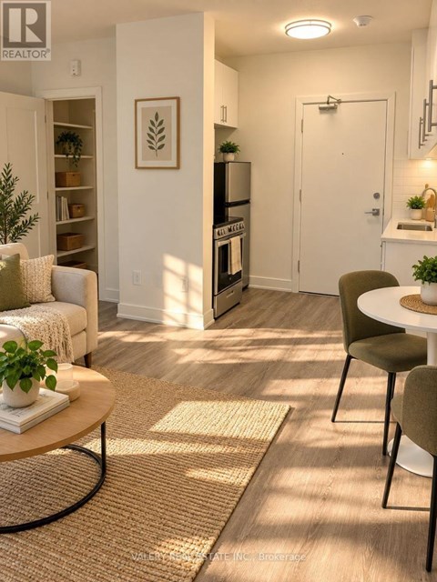 A living room with a white couch, a coffee table, and a dining table with chairs.