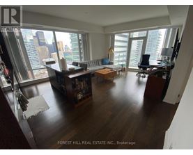 A living room with a view of the city.