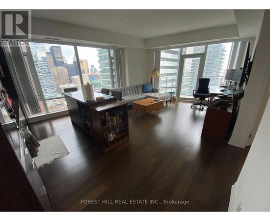 A living room with a view of the city.