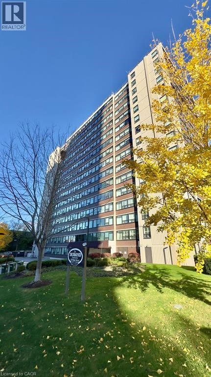 A tall building with a sign that says "REALTY" in front of it.