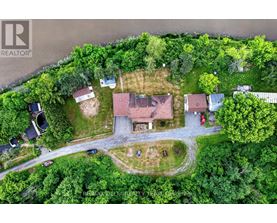 An aerial view of a residential area with houses and trees.