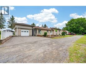 A house with a driveway in front of it.