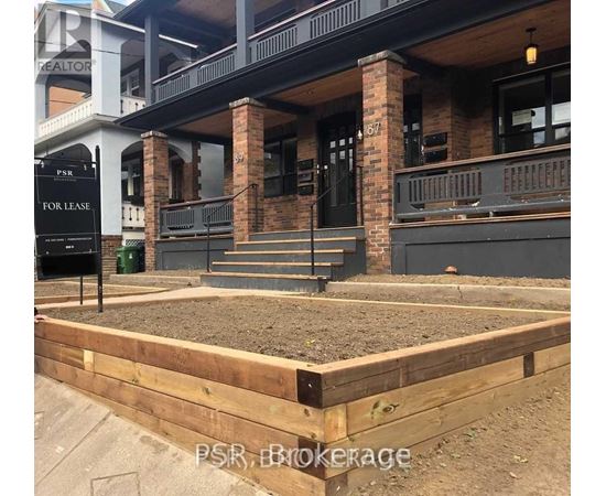 A sign that says "PSR, Brokerage" is in front of a building.