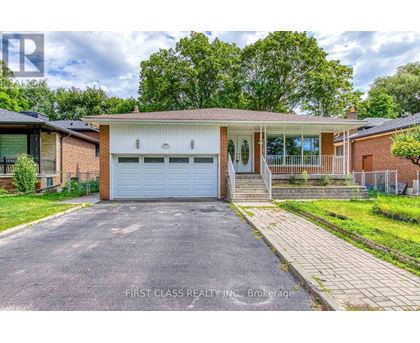 A house with a white garage door is for sale.