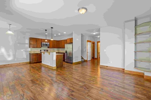 A large open space with wooden floors and a reception desk.