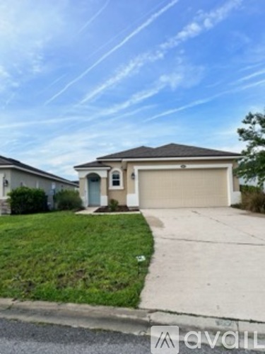 A house with a garage is for sale.