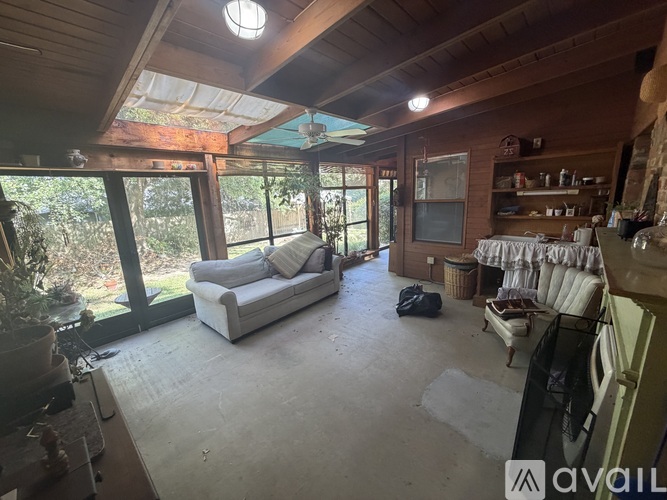 A living room with a couch and a table.