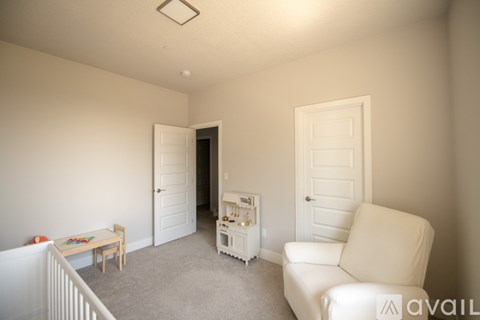 A living room with a white couch and a wooden table.
