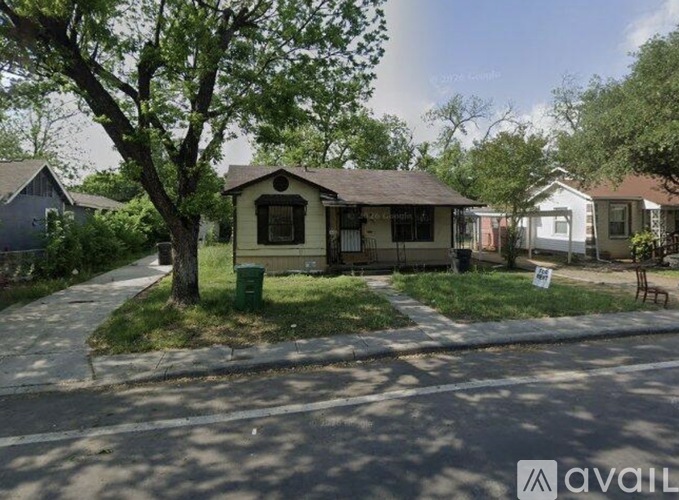A house is for sale in a residential area.