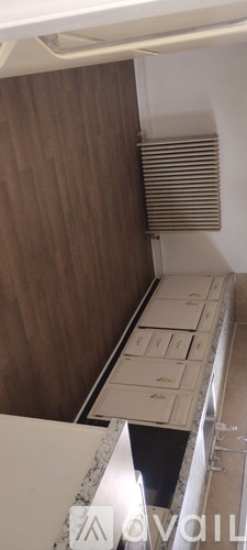 A white refrigerator with a wooden door and a white interior.