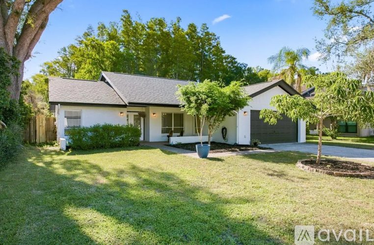 A house with a lawn in front of it is for sale.