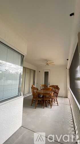 A room with a table and chairs is shown.