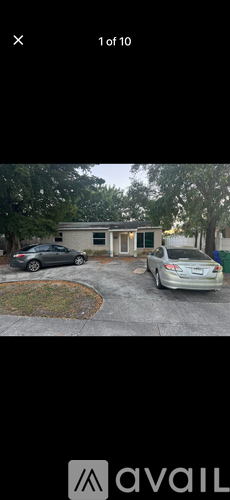 A car is parked in front of a house.
