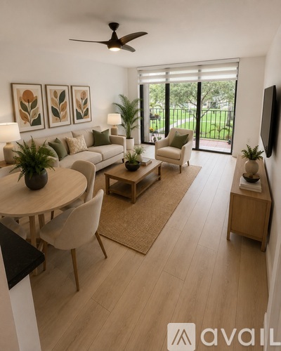 A living room with a ceiling fan and sliding glass doors.