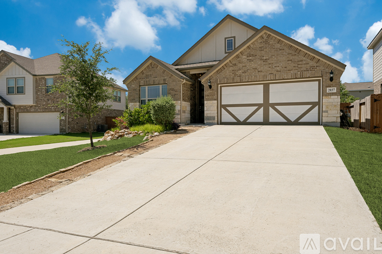 A large house with a garage is available for sale.