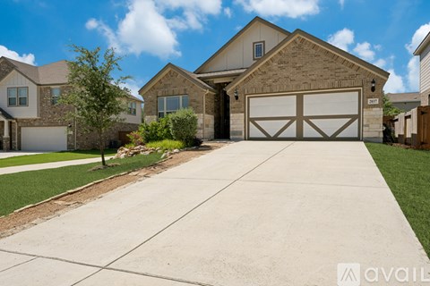 A large house with a garage is available for sale.