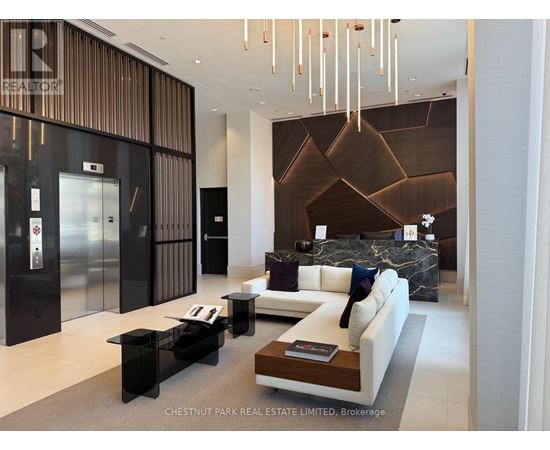 A modern living room with a black and white color scheme.