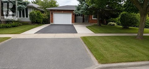A house with a driveway in front of it.