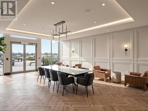 A dining room with a long table and chairs.