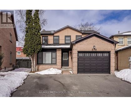 A house with the number 570 on the garage door.