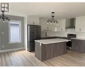 A modern kitchen with a large island in the center.