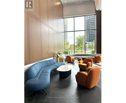 A living room with a blue and orange sofa.