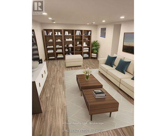 A modern living room with a white sofa, wooden coffee table, and a bookshelf filled with books and decorative items.