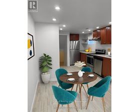 A modern kitchen with a dining table set for two.