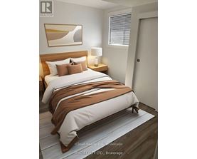 A bedroom with a large bed and a painting on the wall.