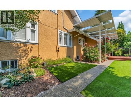 A house with a garden in front of it.