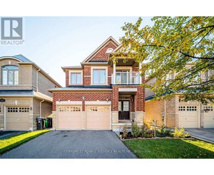 A house with a brick facade and a large front yard.