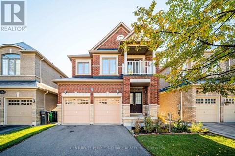 A house with a brick facade and a large front yard.