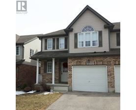 A house with a white garage door is for sale.